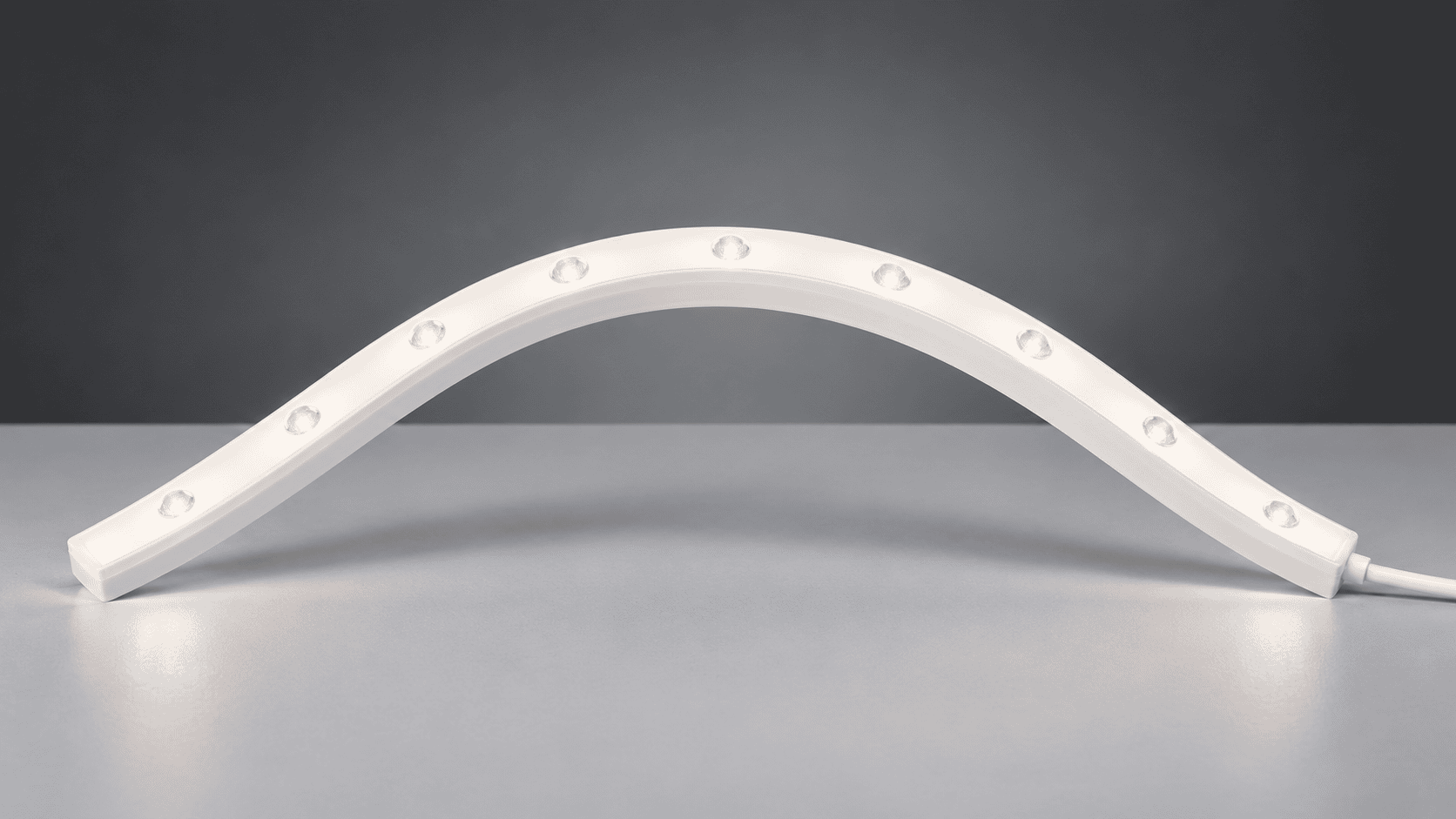 White graze light bending into an arch